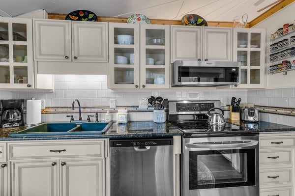 Your fully equipped kitchen awaits with granite counters, stainless appliances, and charming details that make cooking feel like home.
