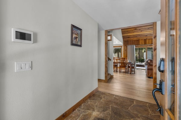 Step into your mountain retreat through this welcoming entryway, where warm wood tones and cozy touches invite you to settle in.